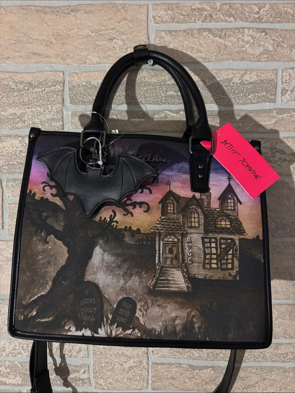 Betsey Johnson Black Satchel with Purple-Pink Sunset Haunted House bat Art